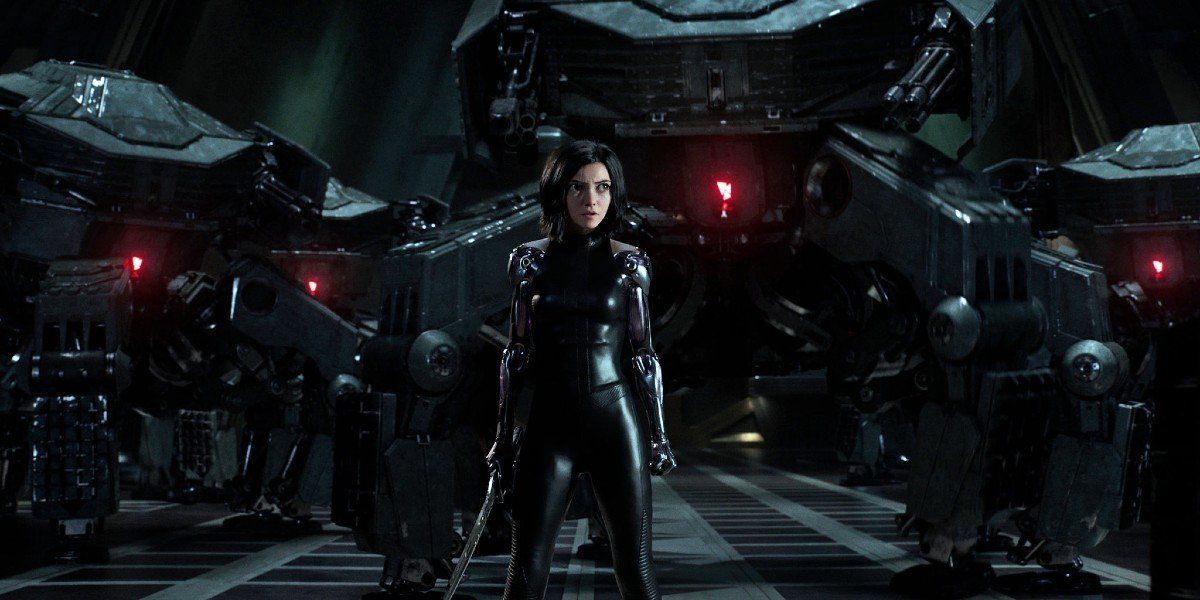 Alita: Battle Angel Alita surrounded by security bots