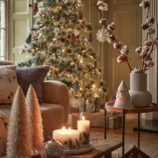 ceramic tree and vase on coffee table in decorated living room