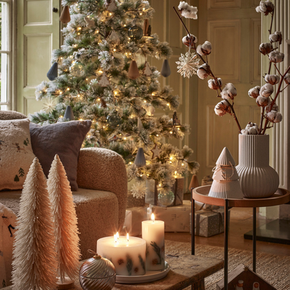 ceramic tree and vase on coffee table in decorated living room