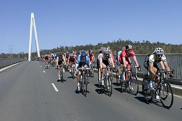 Riders cross the Batman Bridge with the A Frame in the background a unique feature of the bridge that was named after John Batman, one of the founders of Melbourne in Victoria.