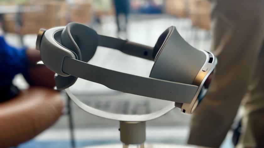 A photo of the Samsung Galaxy XR headset from the right side sitting atop a pedestal angled downward.