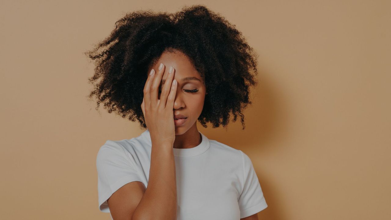 A woman showing the signs of stress