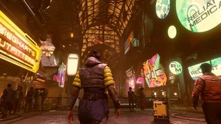 Starfield - Neon city, a player walks through a dense indoor marketplace with neon signs and colorful outfits