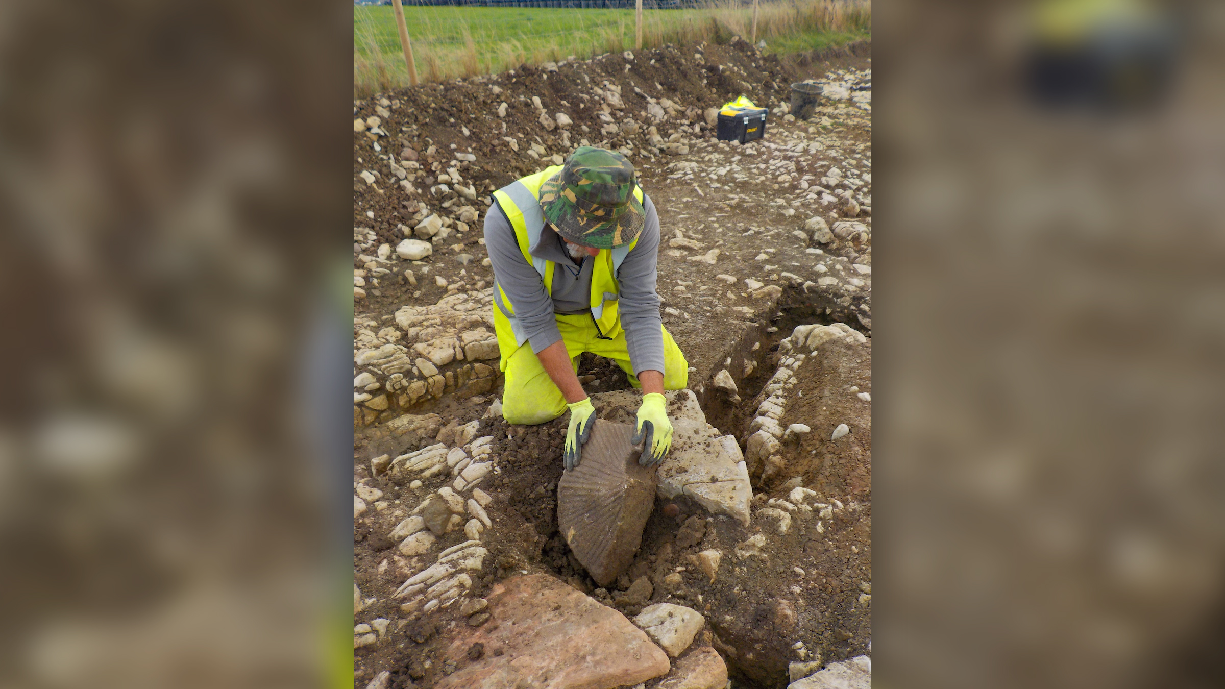 A quernstone, or a stone used for hand grinding grains, from a Romano-British field boundary ditch at the site.