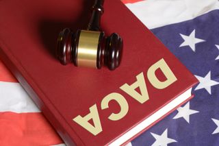 Gavel on a book with "DACA" on it
