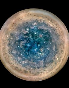 The south pole of Jupiter is seen from an altitude of 32,000 miles (52,000 kilometers) in this enhanced color mosaic of images from NASA's JunoCam. Cyclones up to 600 miles wide (1,000 km) are visible.
