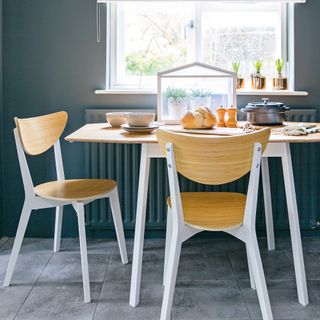 Wooden table and chairs with white painted legs