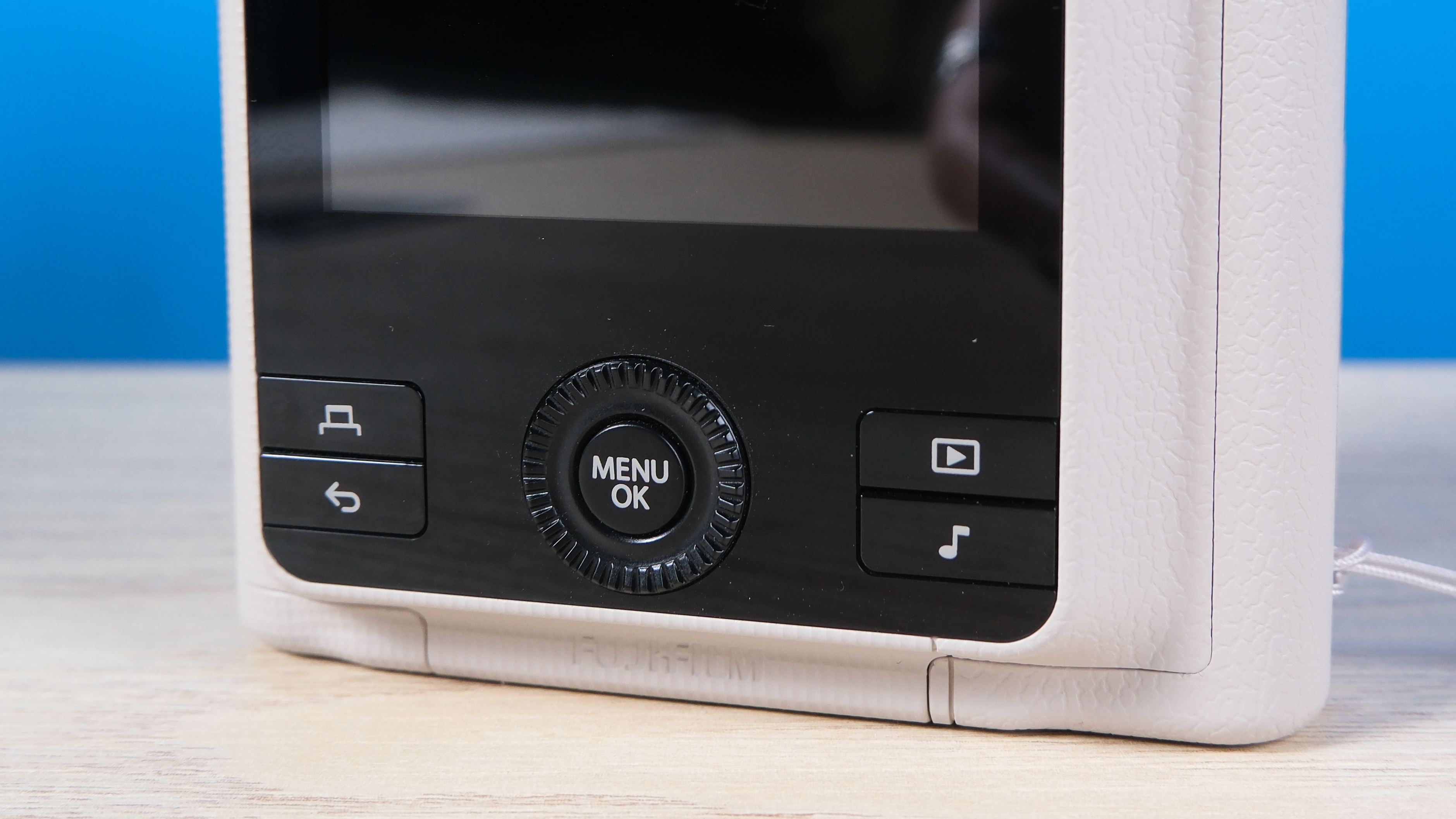 A Sand Beige Fujifilm Instax mini LiPlay Plus hybrid instant camera