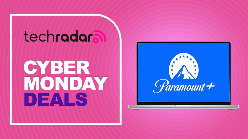 A Cyber Monday deals sign next to a laptop displaying the Paramount+ logo