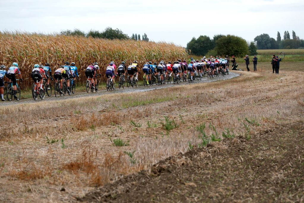 ROUBAIX FRANCE OCTOBER 02 A general view of the peloton competes through Warlaing Brillon cobblestones sector during the 1st ParisRoubaix 2021 Womens Elite a 1164km race from Denain to Roubaix ParisRoubaixFemmes ParisRoubaix on October 02 2021 in Roubaix France Photo by Bas CzerwinskiGetty Images