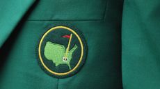 A close up of the Augusta National logo on a green jacket