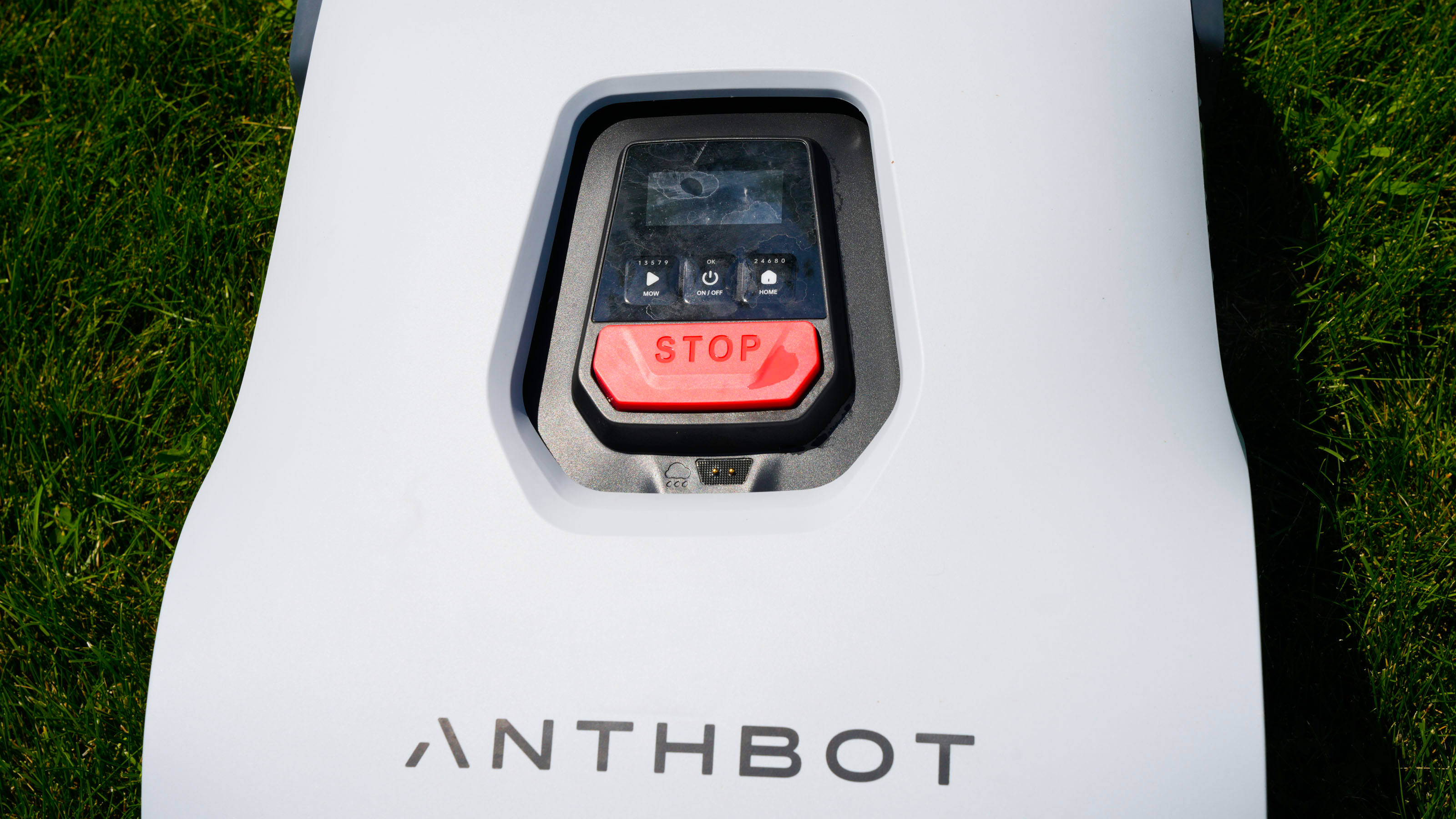 Anthbot Genie 3000 being tested in a bright green yard