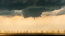 Clouds gather over a UK wind farm