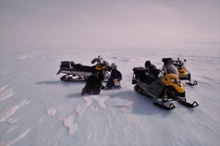 Collecting a meteorite on the Nansen blue ice area, close to the Belgian Antarctic research station Princess Elisabeth.