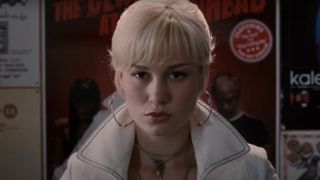 Brie Larson makes an angry face as she stands in front of a poster in Scott Pilgrim vs. The World.