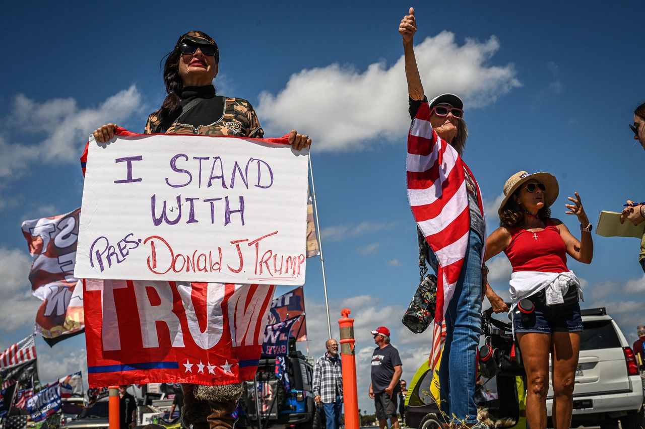 Trump supporters hold signs near Mar-a-Lago 