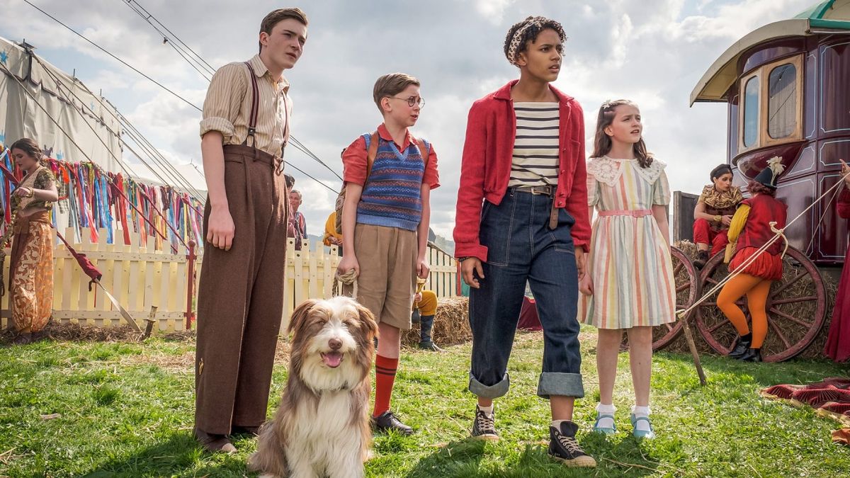 Diaana Babnicova as George, Elliott Rose as Julian, Kit Rakusen as Dick and Flora Jacoby Richardson as Anne with Timmy the dog in &quot;The Famous Five&quot;