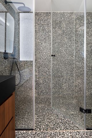 A bathroom with large format tiles in animal print