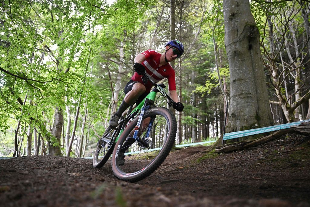 Denmarks Albert Philipsen takes part in the mens Junior Crosscountry Olympic race at the Cycling World Championships in Glentress Forest Scotland on August 10 2023 Photo by Oli SCARFF AFP Photo by OLI SCARFFAFP via Getty Images