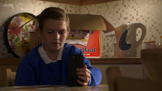 Tommy Moon on the phone to Alfie Moon