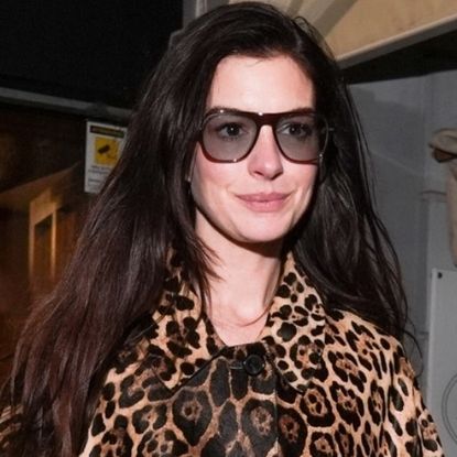 Anne Hathaway turned her leopard-print coat boho with white jeans and clogs