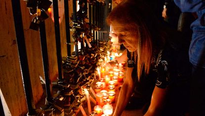 Locals hold a candlelight vigil for slain journalist Daphne Caruana Galizia 