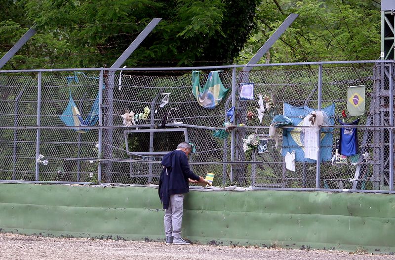 Fans lay wreaths at the Tamburello corner in remembrance of Ayrton Senna who died at the race track in 1994
