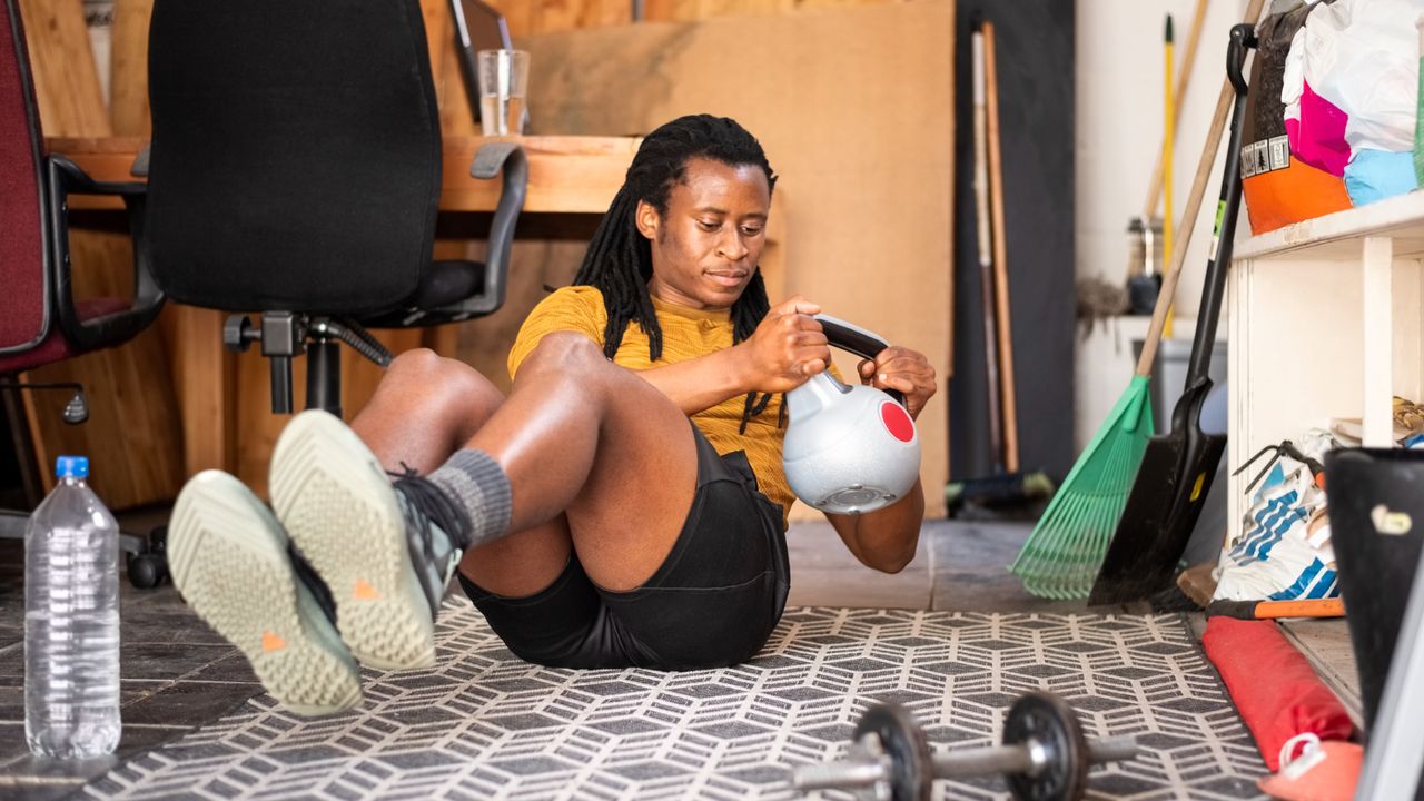 Man performing kettlebell Russian twists