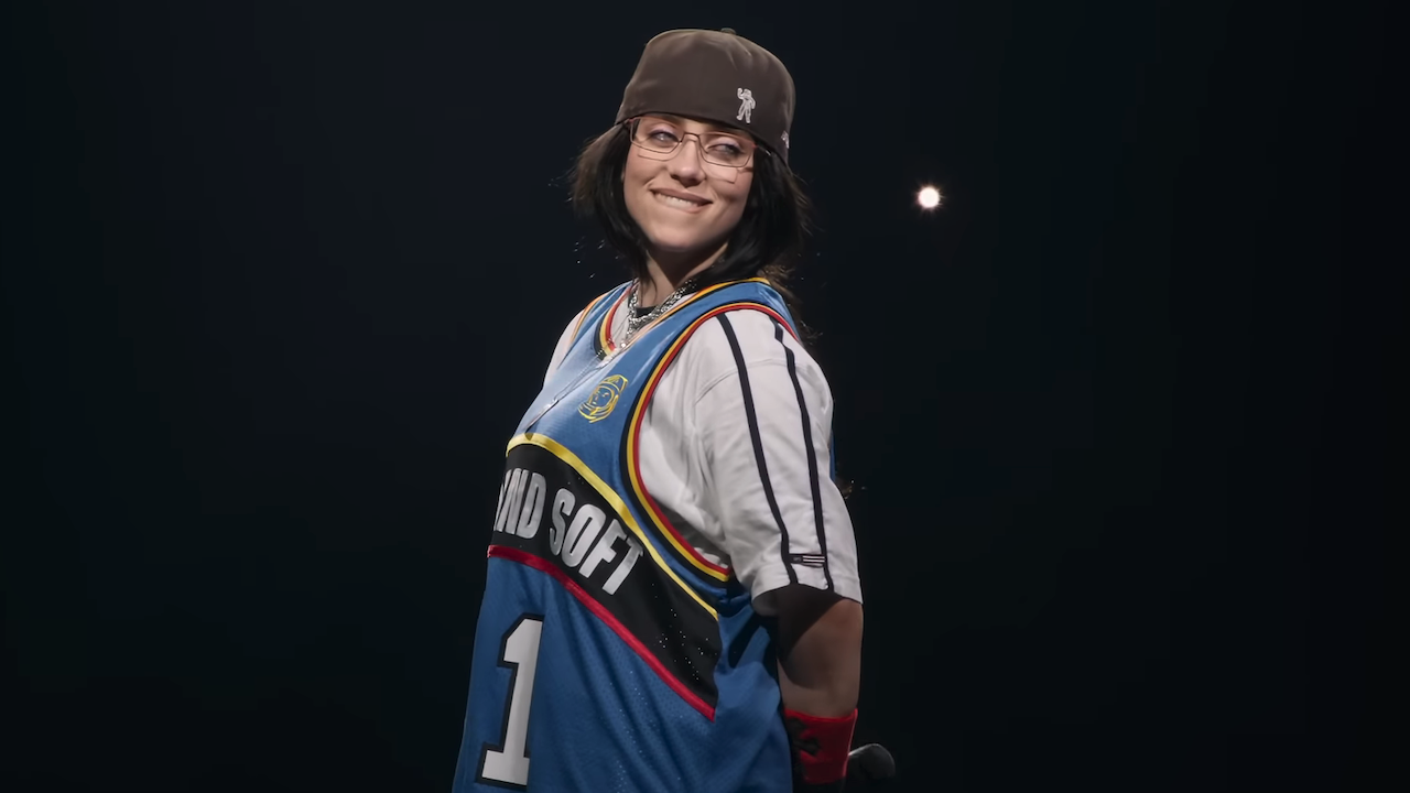 Billie Eilish smiling while on stage in Billie Eilish &ndash; Hit Me Hard and Soft: The Tour (Live in 3D)