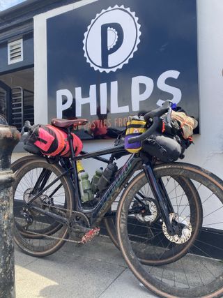 ebikes loaded and parked outside a shop