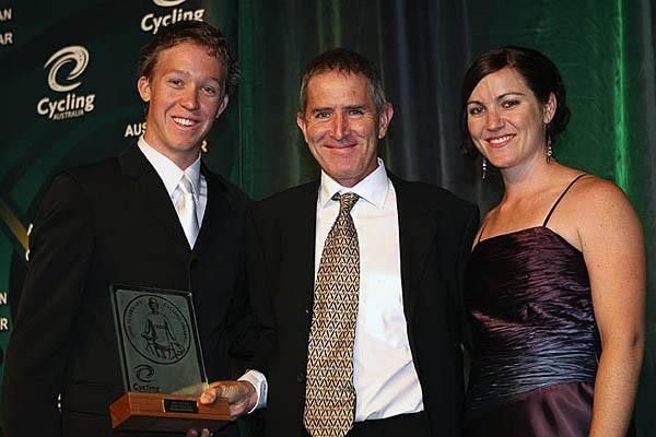 Brian Stephens collected the best coach award from Anna Meares and one of his riders from this season, Cameron Meyer.