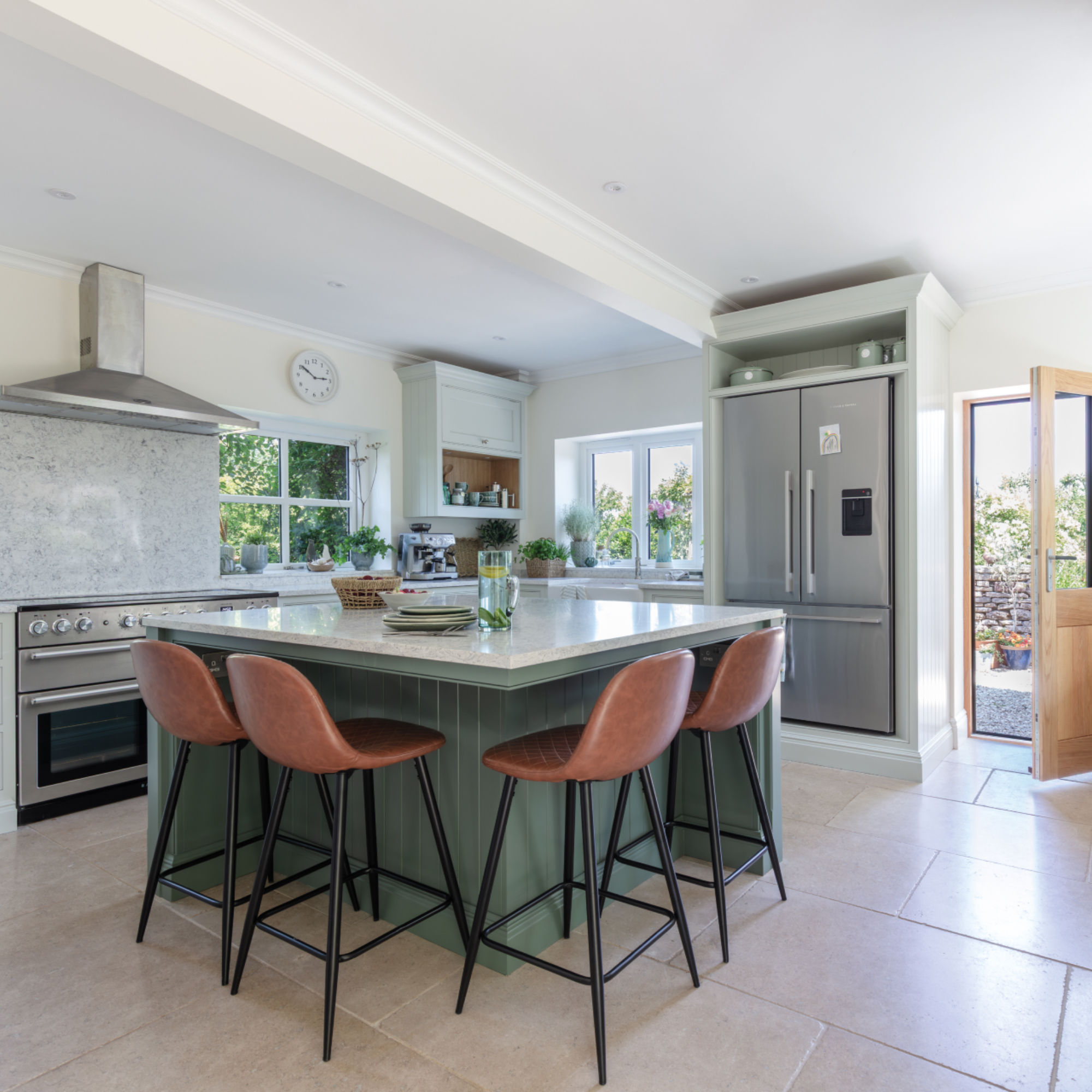 Tom Howley kitchen with large kitchen island/breakfast bar, bar stools, mint green, marble, large American style fridge