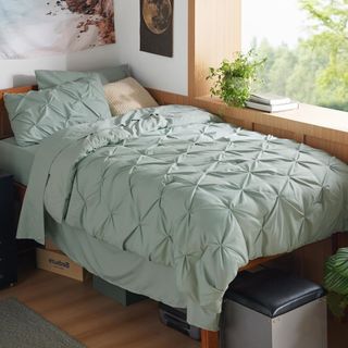 Bedsure Twin XL Comforter Set in sage green on a bed.