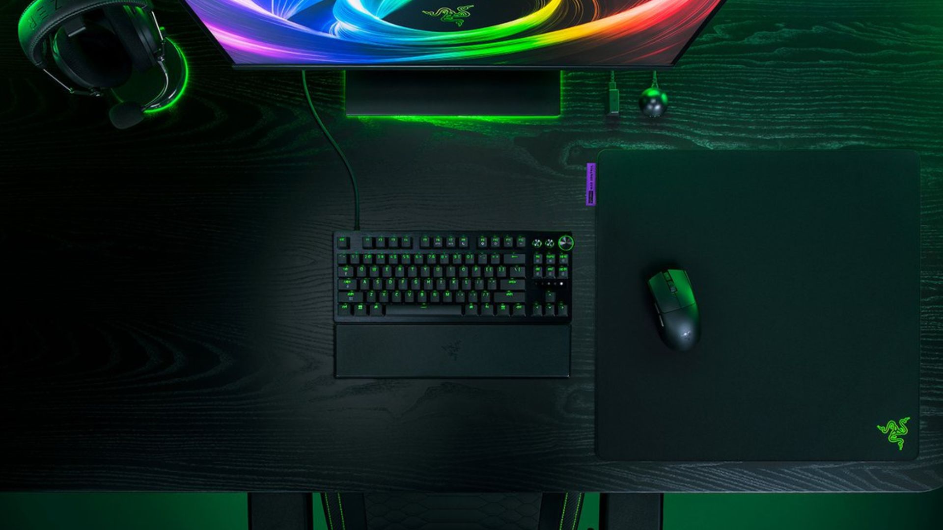 A top-down view of a gaming desk showing the new Razer Gigantus V2 Pro mouse pad