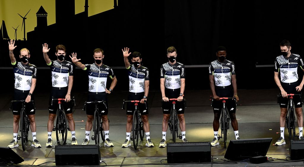 Team Qhubeka Assos riders attend the teams presentation two days ahead of the first stage of the 108th edition of the Tour de France cycling race near Brest on July 24 2021 Photo by Philippe LOPEZ AFP Photo by PHILIPPE LOPEZAFP via Getty Images