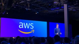 An AWS representative on stage at HPE Discover