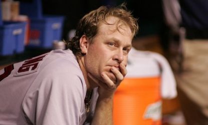 Curt Schilling in the dugout during a 2006 Boston Red Sox game: After his baseball career, Schilling tried his hand at video games, but now his 400-employee company is no more.
