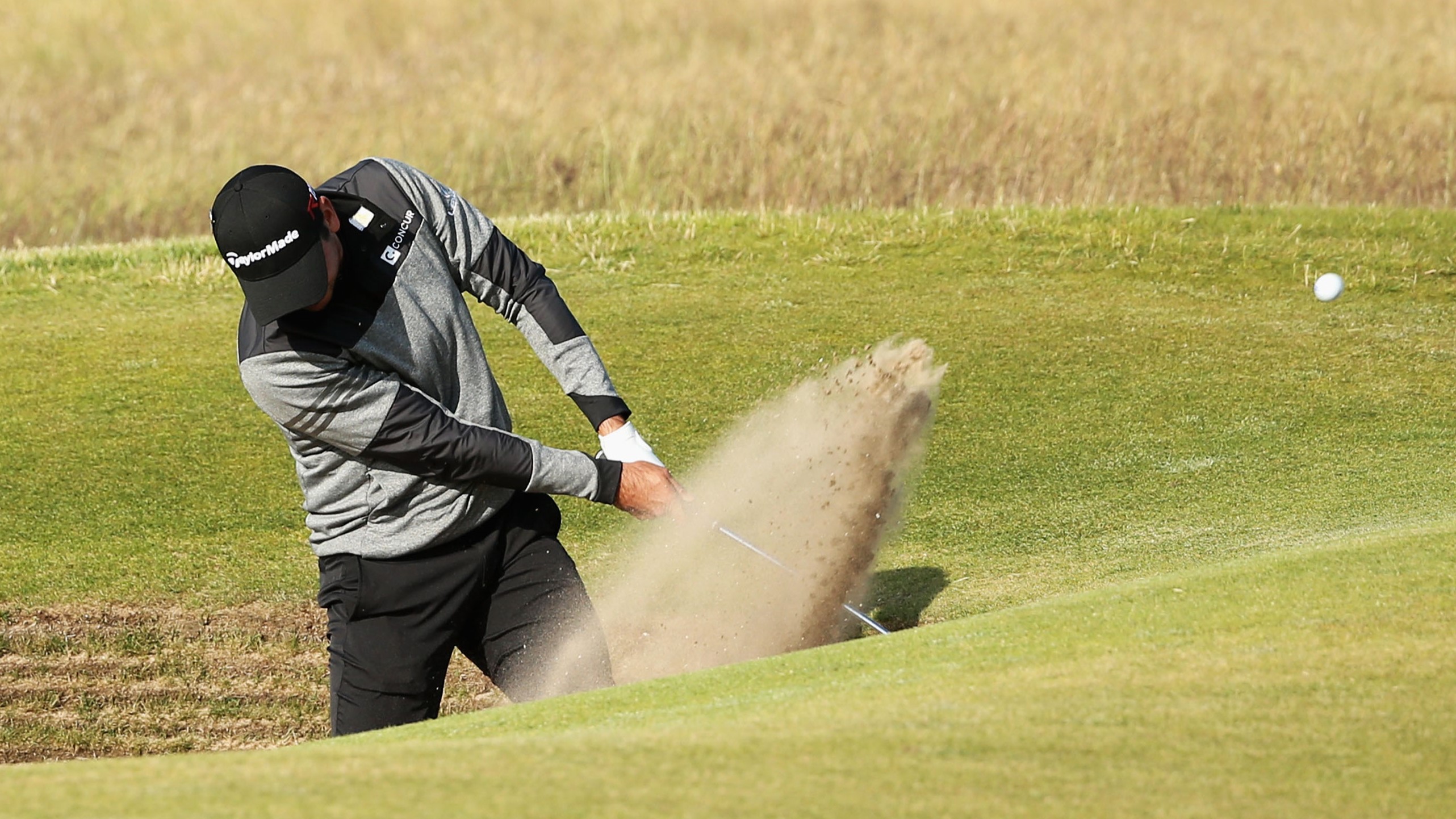 Jason Day plays out of a bunker