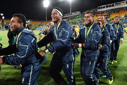 Fiji rugby players celebrate their gold medal victory.
