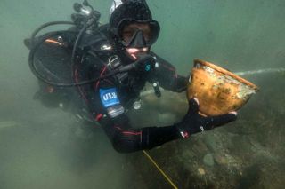 A diver completes an underwater excavation at the site in Lake Titicaca.