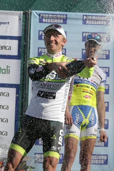 Stage winner Bartosz Huzarski celebrates with some champagne.