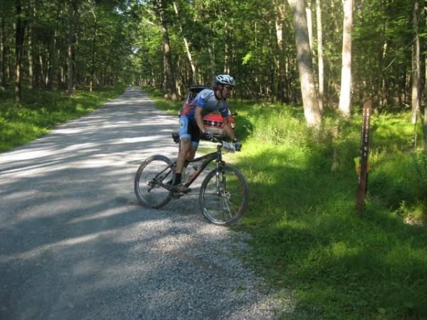 Charlie Clarkson (Ellsworth Bikes) powerslides into the trail en route to Three Bridges.