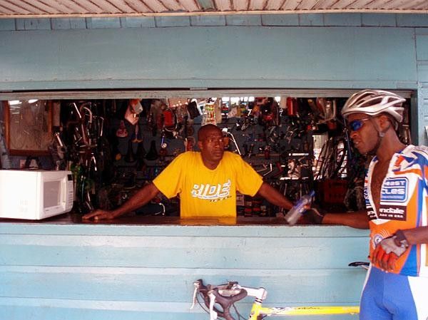 Marochi chatting with Winston at Winston's bike shop in Montego Bay.