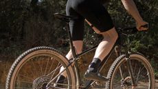 A mountain biker riding a cross-country mountain bike