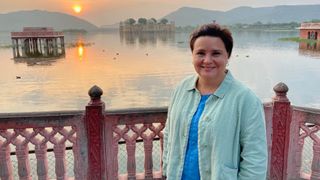 Susan on location in Susan Calman's Cruise of a lifetime wearing a blue top