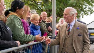King Charles III meets members of the public during a visit to the Discovery Centre and Auld School Close
