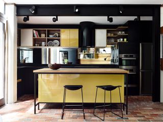 yellow kitchen ideas with black monochrome stools