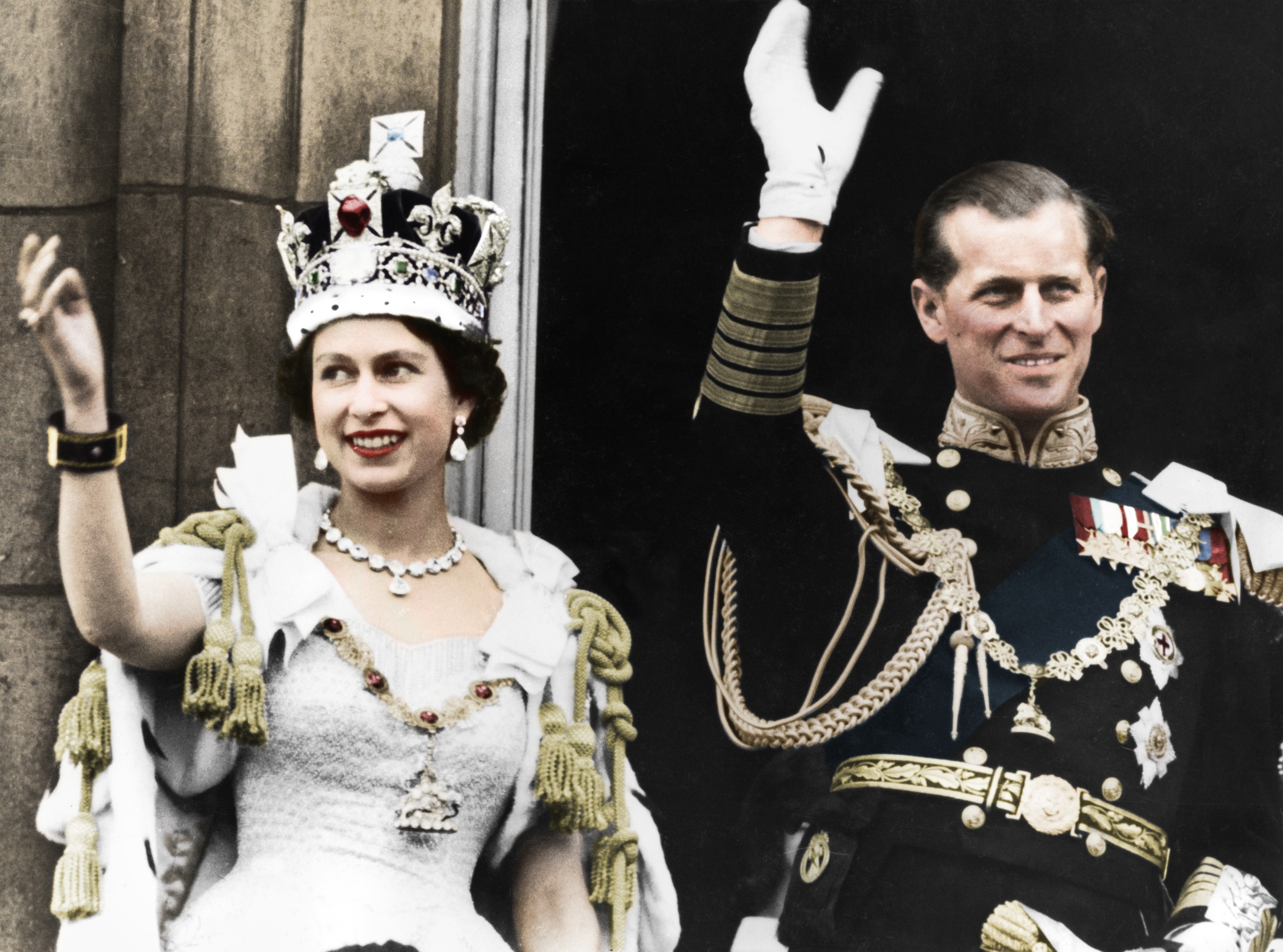 Queen Elizabeth and Prince Philip waving at her coronation