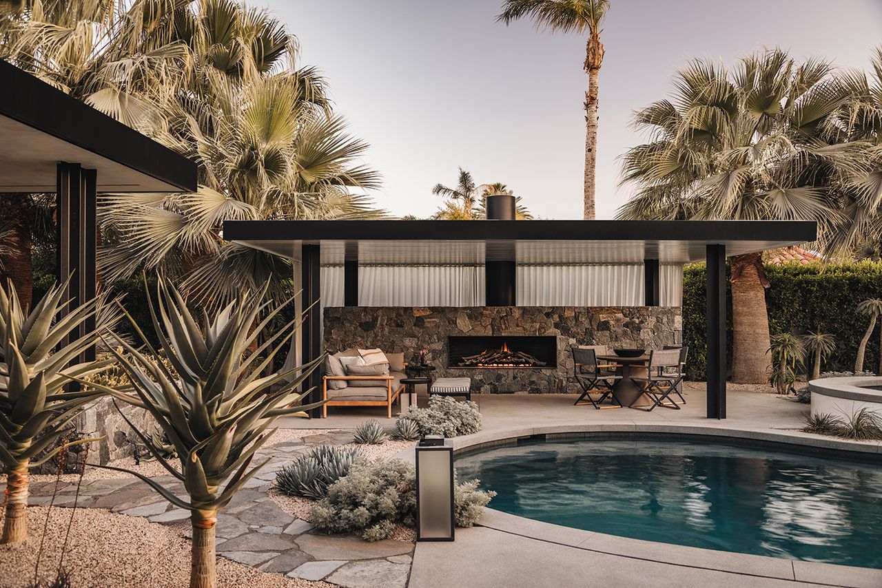 rancho mirage house showcasing low lying, modernist architecture with lots of desert planting and outdoor areas