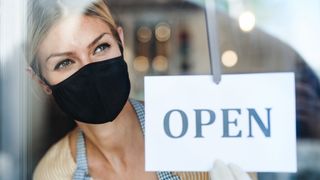 Woman with open sign